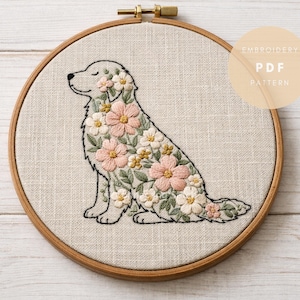 May include: Embroidered dog hoop art showing a golden retriever silhouette filled with pink, white, and yellow floral embroidery. The artwork is set in a wooden embroidery hoop, with the text "EMBROIDERY PDF PATTERN" on a tan circle.