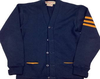 Vintage wool varsity letterman’s cardigan sweater. 1940s/50s. Lasley. Made in the USA. Two front slide pockets. Deep navy and gold.