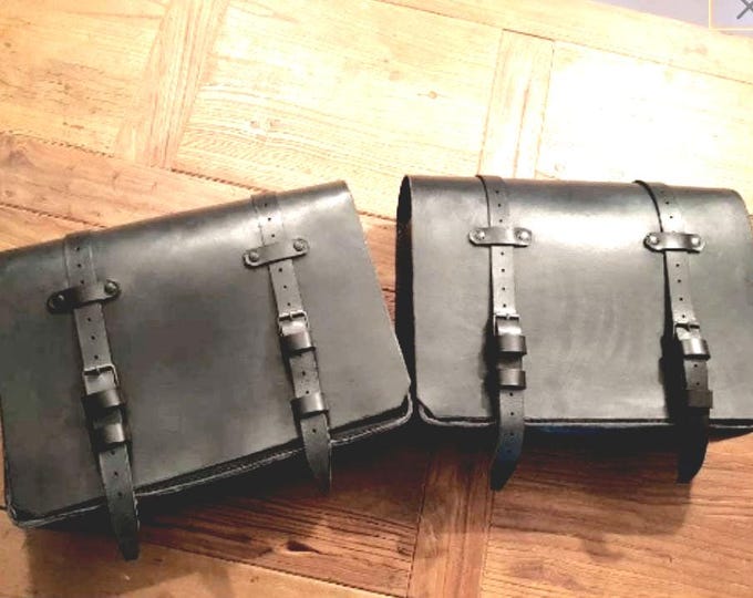 Pair of cafe racer scrambler special motorcycle saddlebags. Black aged leather. Entirely handmade. Entirely handmade.
