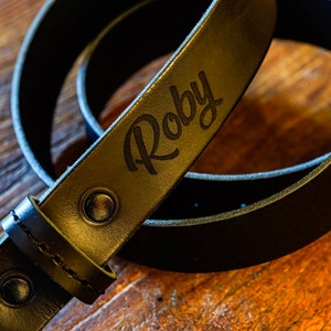 Black leather belt with solid brass buckle and laser customization