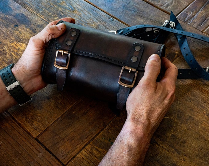 Fork bag for cafe racer, enduro, and scrambler motorcycles. Dark walnut leather.