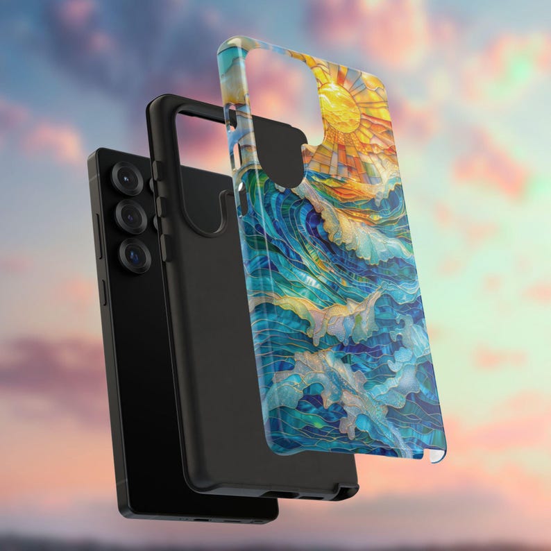 May include: A black smartphone with a protective case featuring a colorful ocean wave and sun design. The case has a clear, glossy finish, and the artwork includes shades of blue, yellow, and white. The phone has three camera lenses.