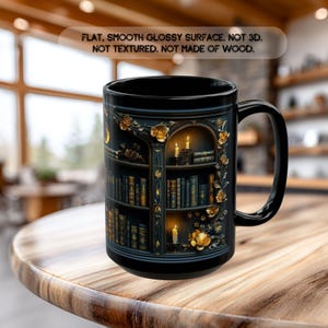 May include: A black ceramic mug featuring a printed design of a dark bookshelf filled with books, lit candles, and gold floral accents. The text on the mug reads: FLAT, SMOOTH GLOSSY SURFACE. NOT 3D. NOT TEXTURED. NOT MADE OF WOOD.
