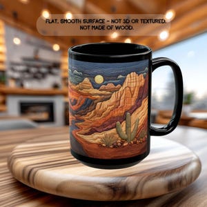 May include: Black ceramic mug featuring a desert landscape design with a full moon, mountains, and cacti. The mug has a black handle and rim. The text on the image says: FLAT, SMOOTH SURFACE - NOT 3D OR TEXTURED. NOT MADE OF WOOD.