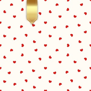 May include: A cream-colored background is covered with small red hearts. A gold ribbon hangs from the top of the image. The hearts are scattered across the surface, creating a pattern. The ribbon has a pointed bottom.