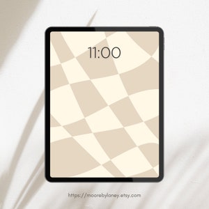 May include: A digital tablet screen displaying a beige and white checkered pattern with a wavy effect. The time 11:00 is displayed on the screen. The text "https://moorebylaney.etsy.com" is displayed at the bottom of the screen.