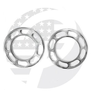 May include: Two silver metal rings with a decorative design of oval cutouts. The rings are similar in size and shape.