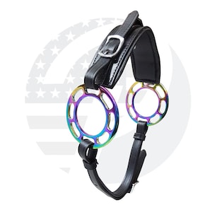 May include: Black leather horse bit with two rainbow colored metal rings. The bit has a buckle on the leather strap.