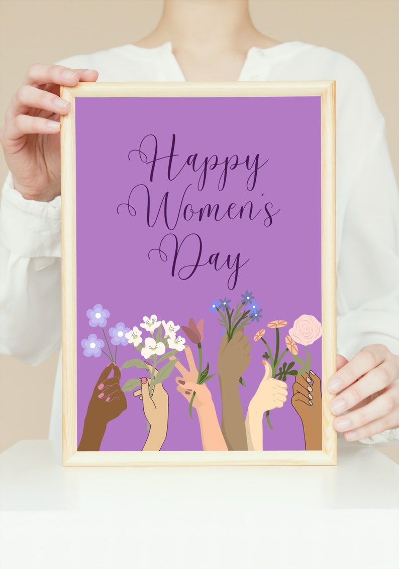 May include: A purple poster with the text "Happy Women's Day" in a purple script font.  The poster features a design of six hands holding flowers in various colors, including white, purple, and pink.