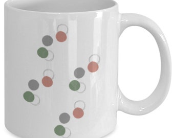 Green and pink abstract circles mug