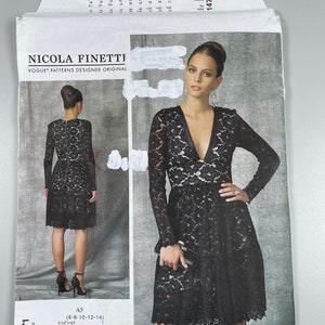May include: A black lace dress with a deep V-neckline and long sleeves. The dress has a fitted bodice and a flared skirt. The pattern number is V1471.