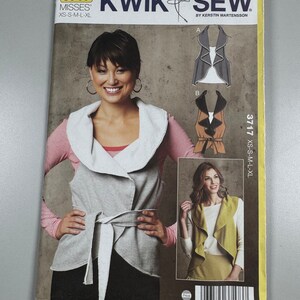 May include: Sewing pattern for a women's vest with a cowl neck. The pattern is called "Kwik Sew" and the number is 3717. The pattern includes instructions for making three different styles of vests.