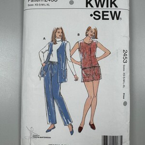 May include: A sewing pattern for a sleeveless top and trousers or skirt. The pattern is from Kwik-Sew Pattern Co., Inc. and is for sizes XS-S-M-L-XL. The pattern number is 2453.