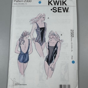 May include: A Kwik Sew pattern envelope for pattern 2333, featuring illustrations of two leotard designs labeled A and B. The white envelope displays the pattern number, size range XS-S-M-L-XL, brand logo, and a barcode at the bottom.