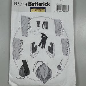 May include: A sewing pattern for a historical costume, featuring a pair of gauntlets, a pouch, and a pair of leggings. The pattern is from Butterick Making History and is size OSZ.