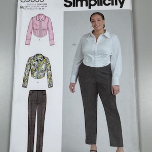 May include: Simplicity sewing pattern S9855 showing a woman's outfit. The pattern includes illustrations of a pink jacket, a floral jacket, and brown trousers. The pattern size is U.S. 20W-28W. The Simplicity logo is at the top.