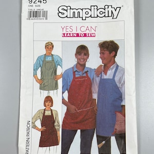 May include: A Simplicity sewing pattern envelope with the number 9245 and the words "YES I CAN" and "LEARN TO SEW". The envelope shows three people wearing different aprons. The pattern is for one size.