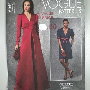 May include: Vogue Patterns sewing pattern for a dress with a V-neckline and puff sleeves. The pattern includes two different styles: a long red dress and a shorter blue dress with a red ribbon belt. The pattern is labeled "V1654" and "CustomFit for A,B,C,D cup sizes".