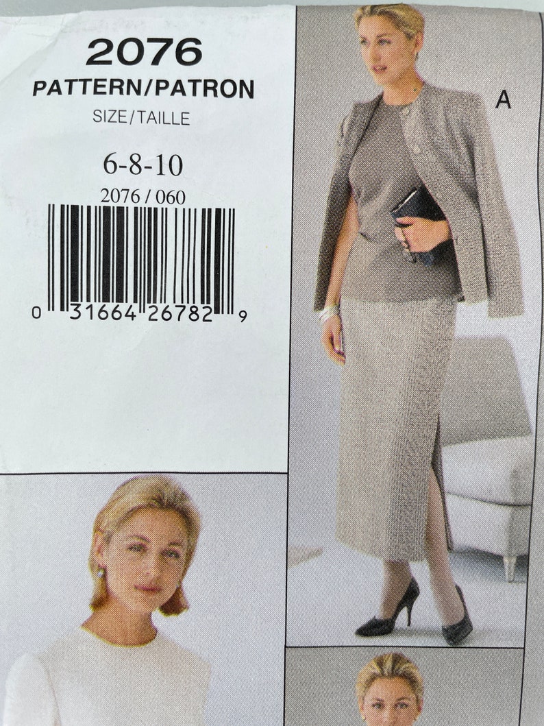 May include: A sewing pattern for a skirt and jacket set. The pattern number is 2076 and the sizes are 6-8-10. The pattern is for a skirt with a side slit and a jacket with a collar.