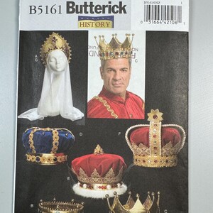 May include: A sewing pattern for making crowns, with a variety of styles and colors. The pattern is from Butterick, and the pattern number is B5161/OSZ. The pattern includes instructions for making a blue velvet crown with gold trim, a red velvet crown with gold trim, a gold crown with red and green jewels, and a gold crown with blue and green jewels.
