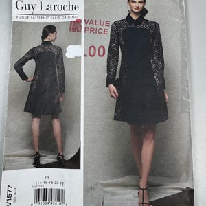 May include: A Guy Laroche Vogue Patterns sewing pattern envelope for a black dress featuring long sleeves, a collar, and intricate lace-like cut-out detailing on the sides and sleeves. The envelope displays the model from front and back views.