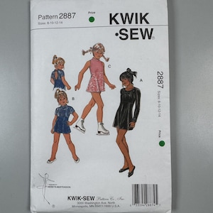 May include: A Kwik Sew pattern envelope 2887 for sizes 8-10-12-14. The white envelope features illustrations of three different dress styles labeled A, B, and C, worn by figures. Text includes Kwik Sew, Pattern 2887, and company address details.