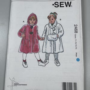 May include: A Kwik Sew pattern envelope 2468 for children's coats in sizes T1-T4. The illustration shows two coat styles: a hooded magenta coat with two buttons and a white faux fur coat with a matching muff. Includes text and a barcode.