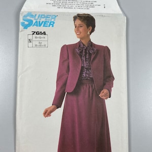 May include: A sewing pattern envelope for a women's skirt and jacket set. The pattern is for sizes 10-14 and 38-42. The model is wearing a burgundy skirt and jacket set with a patterned blouse. The pattern number is 7614.