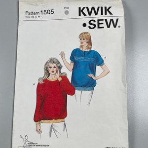 May include: A sewing pattern for a loose-fitting, long-sleeved top with a round neckline. The pattern is from Kwik Sew Pattern Co., Inc. and is for sizes XS-S-M-L. The pattern shows two different versions of the top, one in red and one in blue.