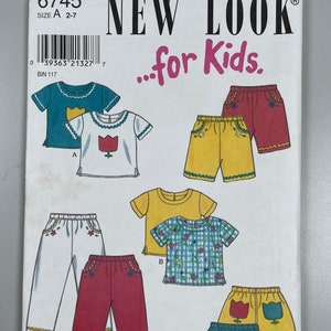 May include: A sewing pattern for children's clothing, featuring a white, yellow and blue skirt with a tulip design, a yellow and white gingham shirt, a yellow shirt, a white shirt with a red tulip design, a pair of white trousers with floral embroidery, and a pair of red trousers with floral embroidery. The pattern is from New Look for Kids and is size 2-7.