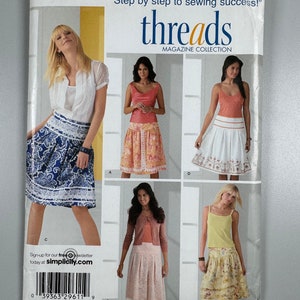 May include: A sewing pattern for a skirt, with four different styles shown. The pattern is for sizes 8, 10, 12, 14, and 16. The pattern is from Simplicity Threads Magazine Collection.