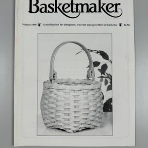 May include: A magazine cover for Basketmaker, a publication for designers, weavers, and collectors of basketry. The cover features a photograph of a small, woven basket with a handle.
