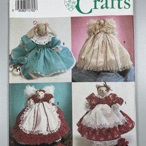 May include: Simplicity Crafts pattern 7477 for making four different doll designs. The dolls are a bunny, a bear, and two bears wearing dresses. The pattern includes instructions for making the dolls and their clothing.