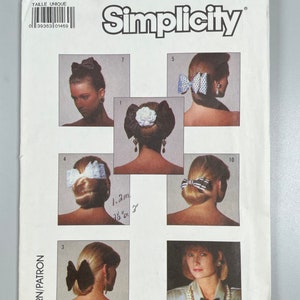 May include: Simplicity pattern 8000 for hair accessories. The pattern includes instructions for making 10 different hair bows and clips. The pattern is for one size.