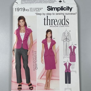 May include: Simplicity 1919 sewing pattern for women's suits. The pattern features a jacket and pants or skirt options. The package includes images of the finished garments and the text "Step by step to sewing success!"