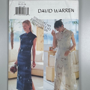 May include: A sewing pattern envelope for a dress with a mandarin collar and a side slit. The pattern is by Butterick and is designed by David Warren. The pattern is for sizes 20-22-24.