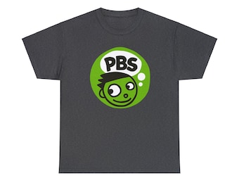 May include: A dark heather grey t-shirt with a green circle featuring a cartoon character with a thought bubble that says "PBS".