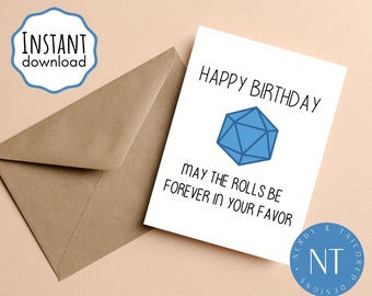 May include: A white card with a blue 20-sided die and the text "Happy Birthday. May the rolls be forever in your favor."  The card is on a light brown surface.
