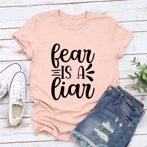Fear Is A Liar Printed Stylish T-Shirt - Trendy Graphic Casual Soft Stuff Tee - Fashionable Round Neck Summer Custom Cotton Tees