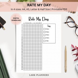 May include: Printable Rate My Day planner with a grid for each month of the year. The planner has a key with a 5-star rating system.