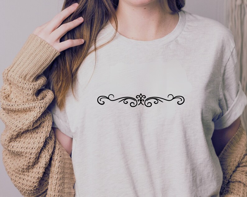 May include: A white t-shirt with a simple black decorative design on the front.