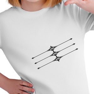 May include: White t-shirt with a black design of four stylized arrows with flower-like accents.