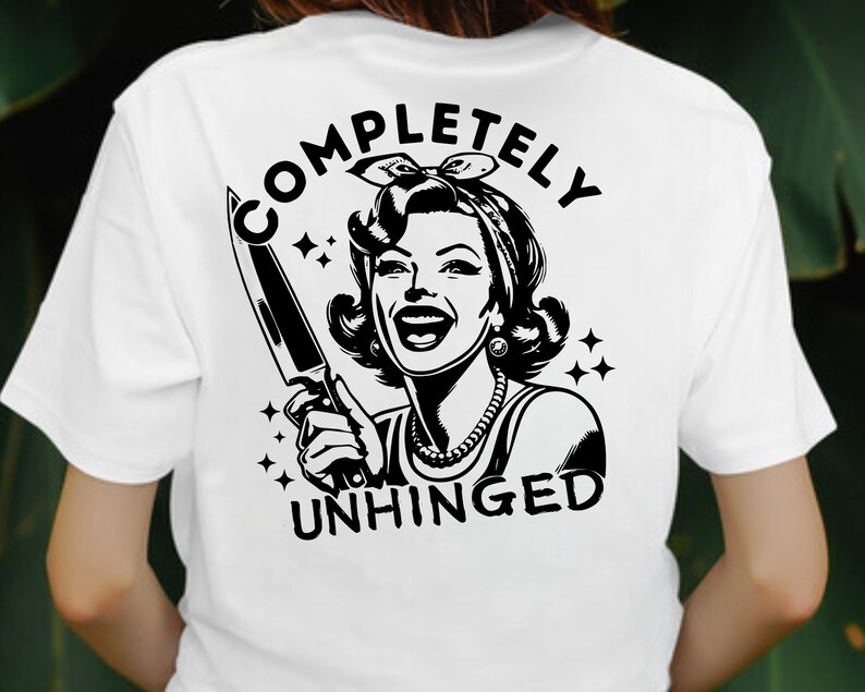 May include: White t-shirt with a black and white illustration of a woman holding a knife. The text "COMPLETELY UNHINGED" is printed on the shirt.