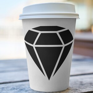 May include: A white takeaway coffee cup with a black diamond graphic printed on the side.