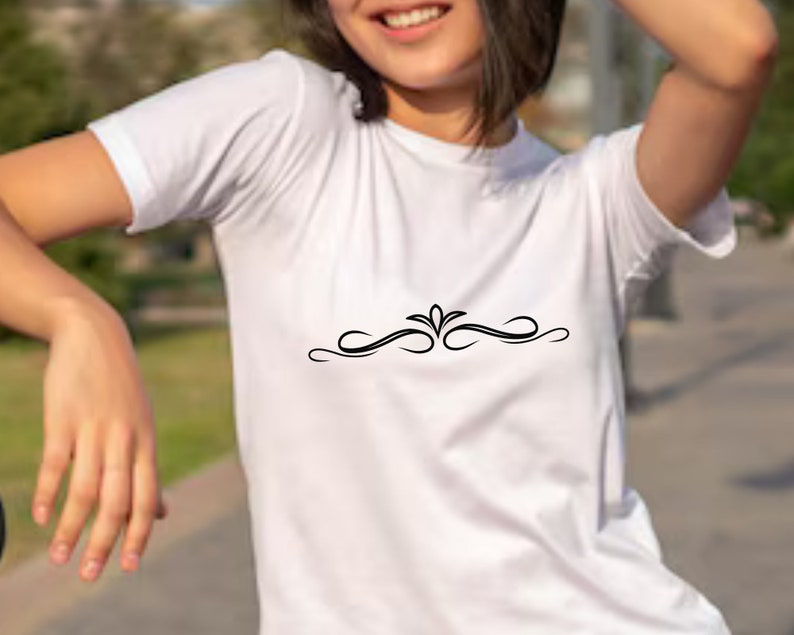 May include: White t-shirt with a black decorative design on the front.