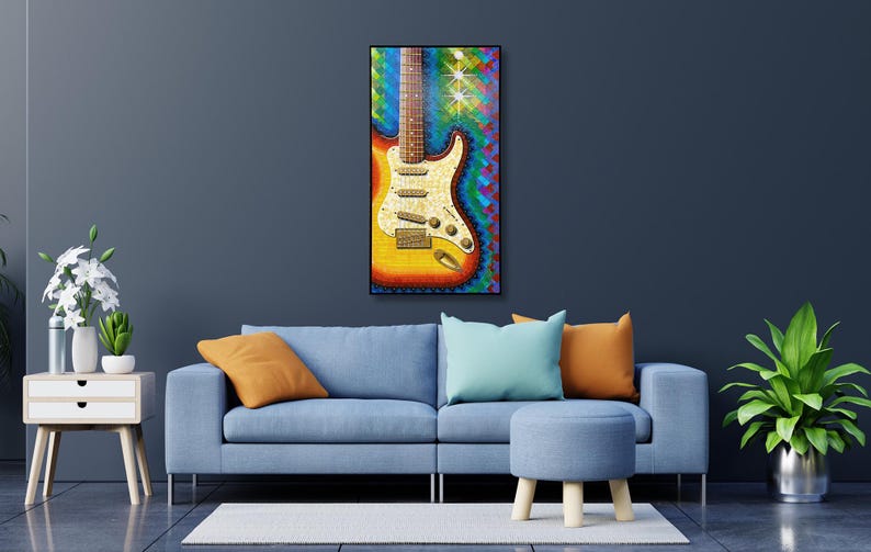 Puede incluir: Una impresi&oacute;n de arte mural rectangular que presenta una guitarra el&eacute;ctrica vibrante y multicolor con acabado sunburst, un golpeador de perloide blanco y tres pastillas, sobre un fondo din&aacute;mico y texturizado de pinceladas azules, verdes y rojas.