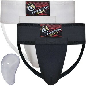 May include: Two athletic supporter jockstraps with a white and black design. The jockstraps have a white elastic waistband with the text "Athletics Gear" in red and black. The jockstraps have a black cup pouch and a white elastic strap that goes around the legs. The set also includes a clear plastic cup.