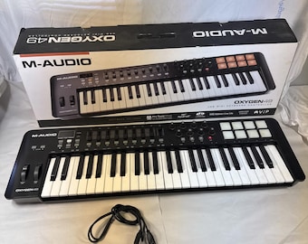 Controlador de teclado MIDI M-Audio Oxygen49 con cable USB. Probado y funcionando.