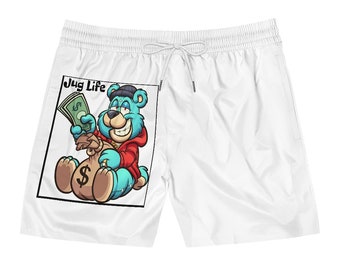 May include: White swim trunks with a cartoon bear wearing a red hoodie and holding a bag of money. The text "Jug Life" is printed above the bear.