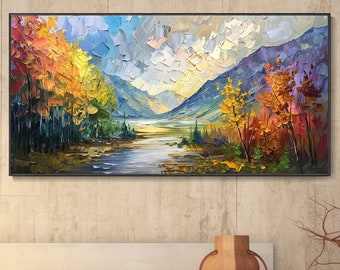 May include: A painting of a landscape with a river flowing through a forest with colorful trees in the fall. The mountains in the background are painted in shades of blue and purple.